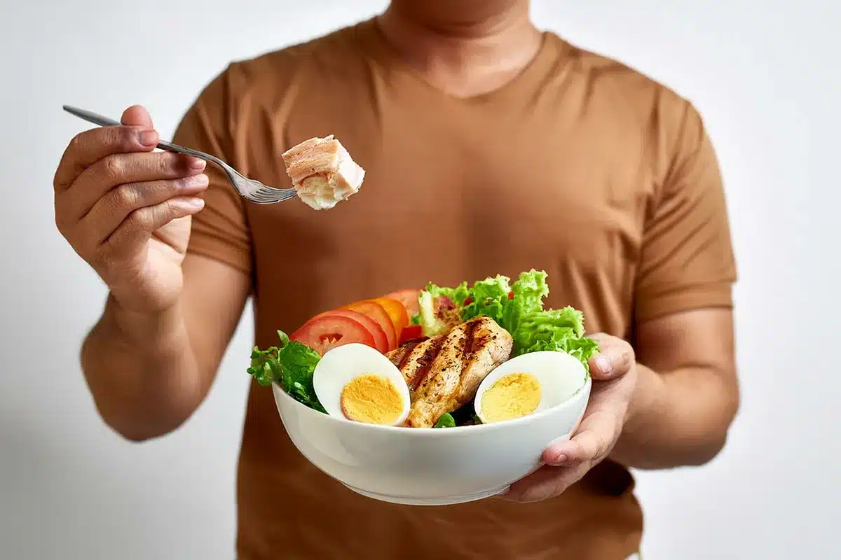 Man eating a healthy salad.