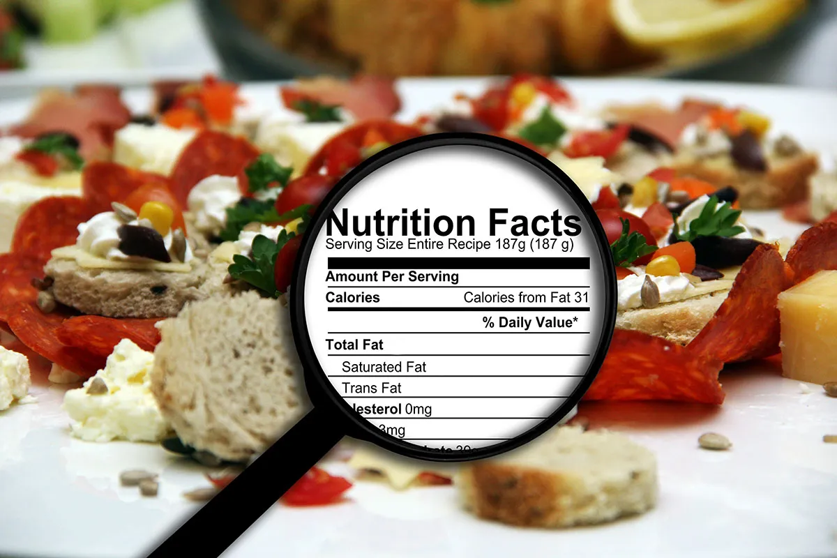 Magnifying glass on nutrition facts label.