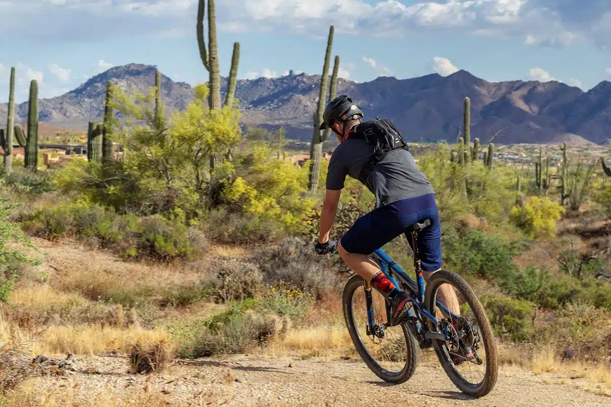 Mountain biker on desert trail.