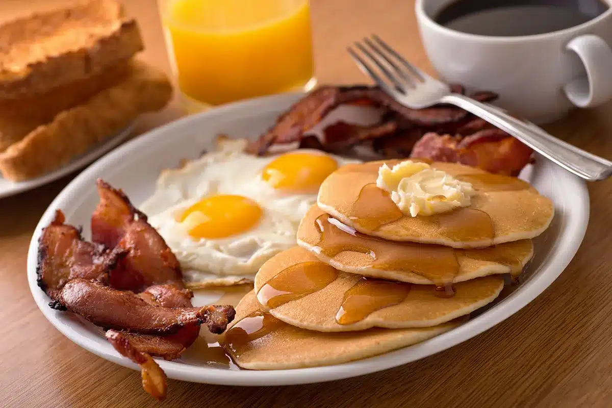 Pancakes, eggs, and bacon breakfast.