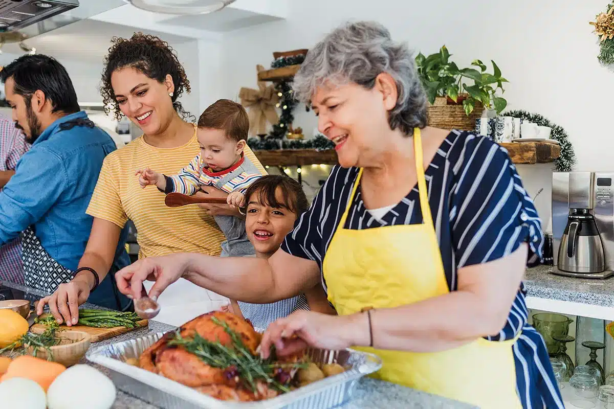 Family preparing Thanksgiving dinner.