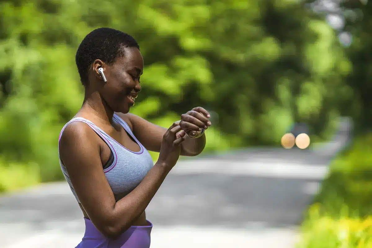 Woman checking fitness tracker.