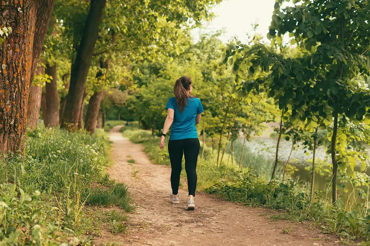 Woman walking outdoors.