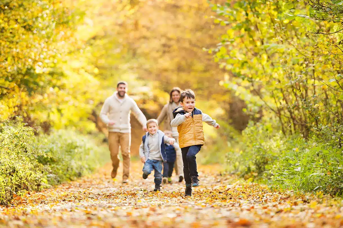 Family enjoying an autumn walk.