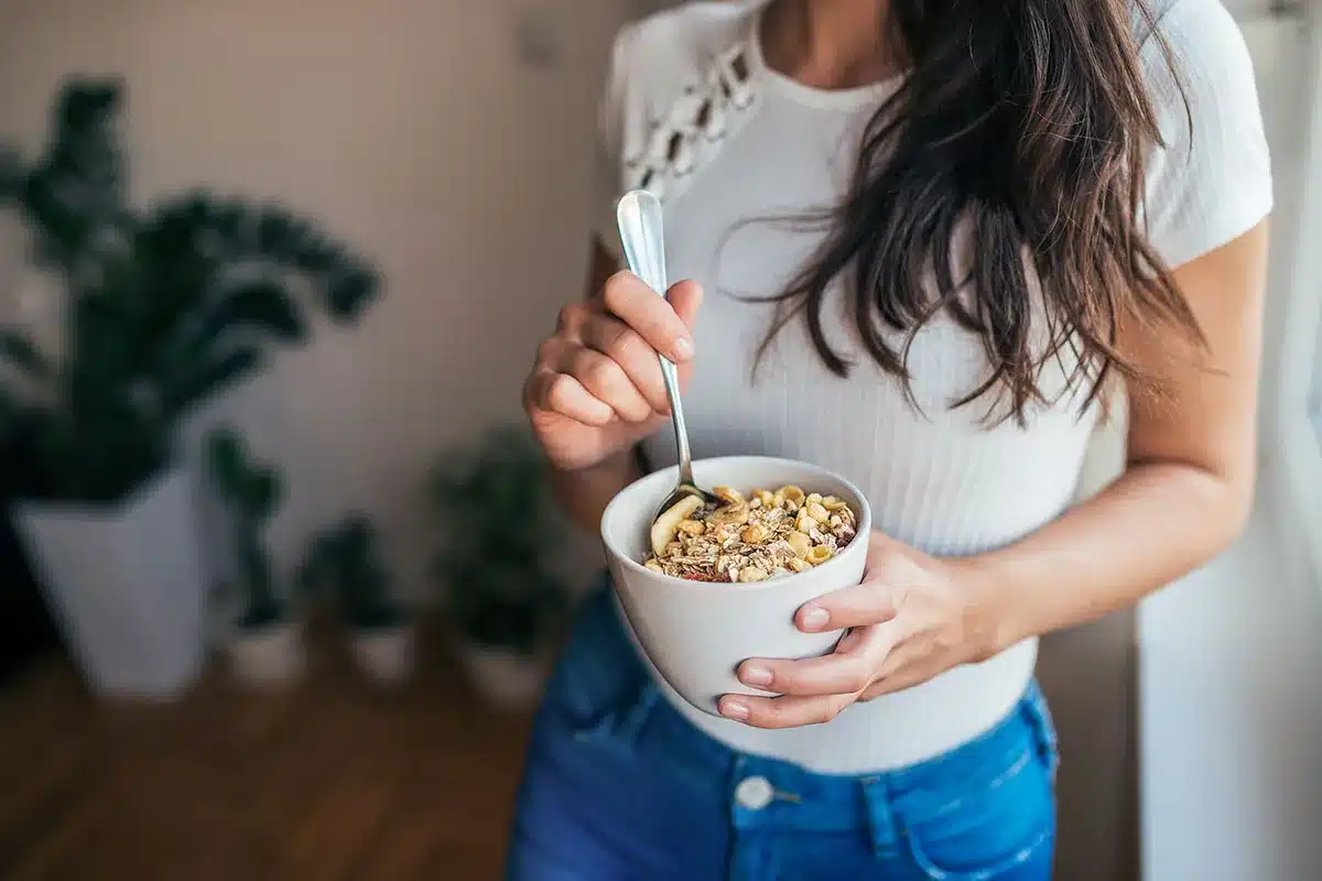 Woman eating breakfast.