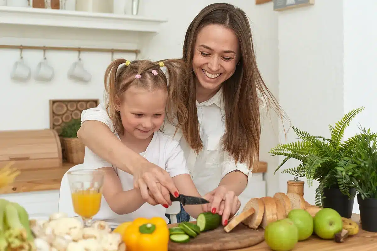 Mother and daughter cooking.