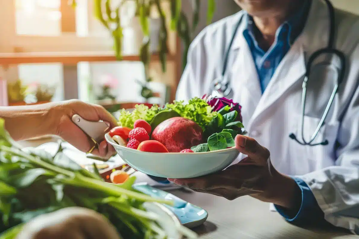 Doctor handing a patient a bowl of healthy food.
