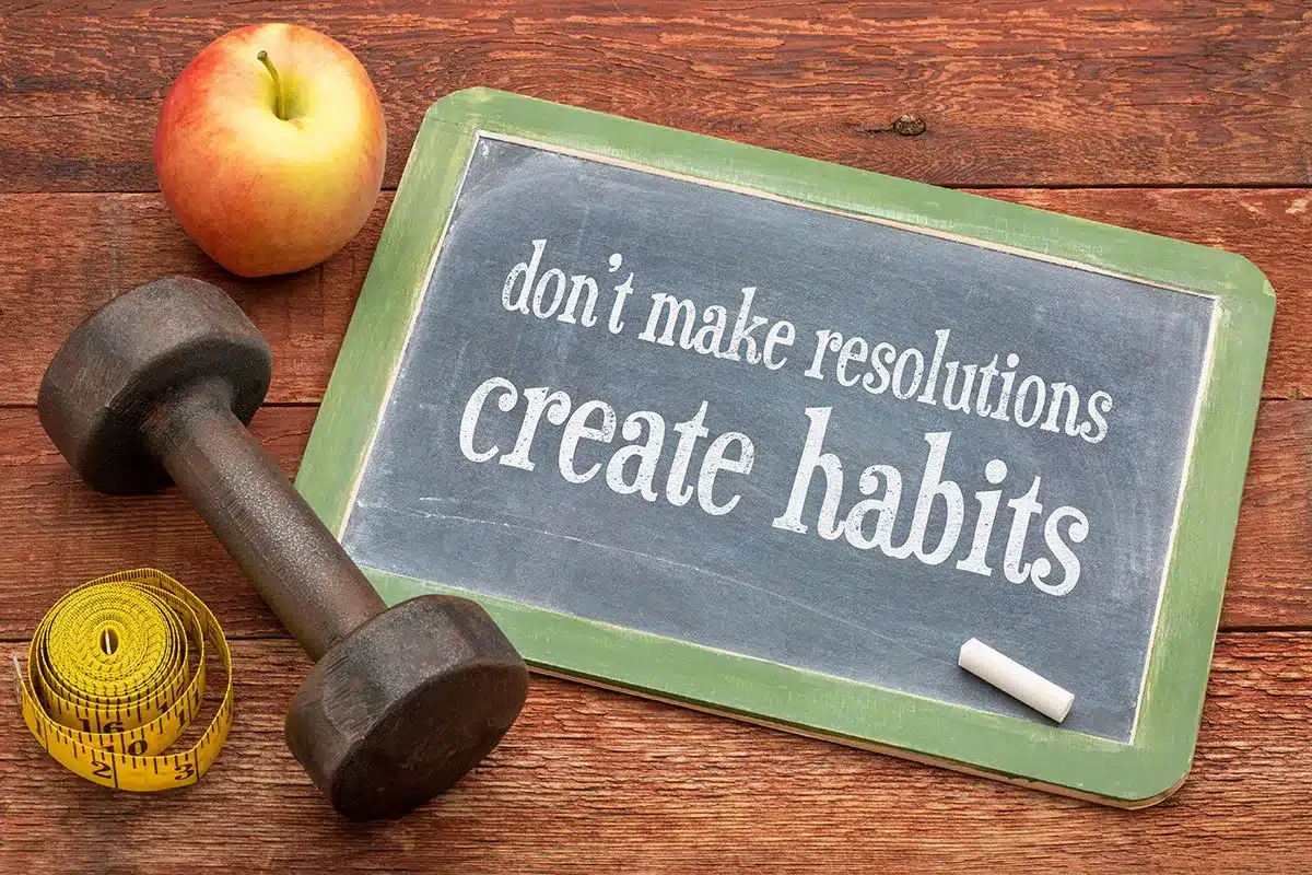 Chalkboard with "Don't make resolutions, create habits."