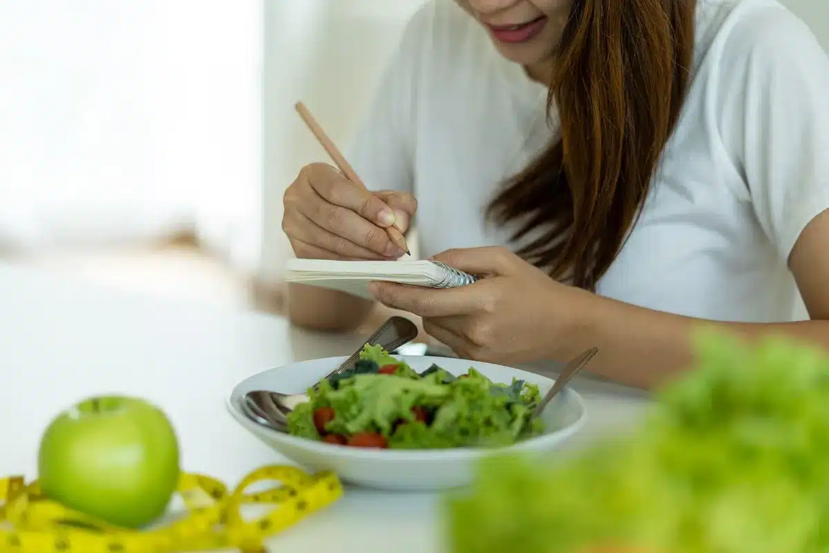Woman planning healthy meal.