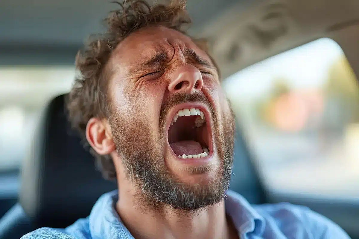 Man screaming in car.