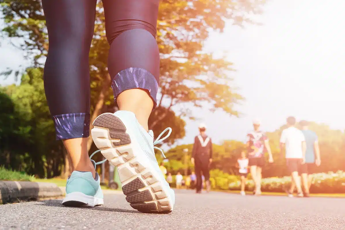 Person walking in park.
