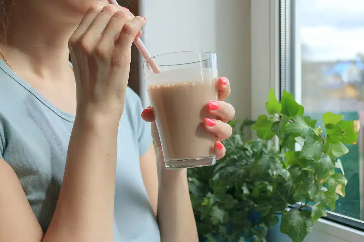 Woman drinking a smoothie.