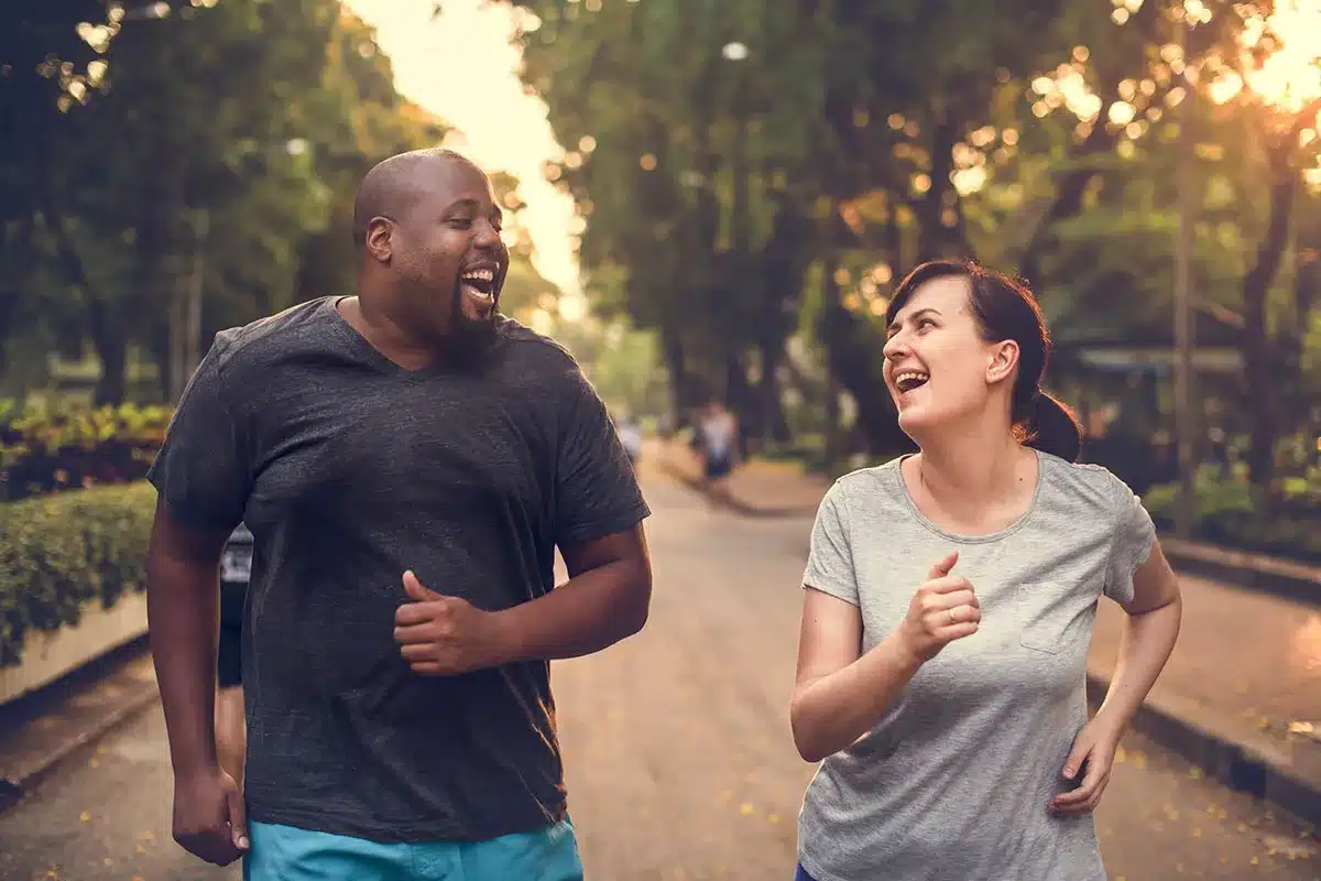 Happy couple jogging together.