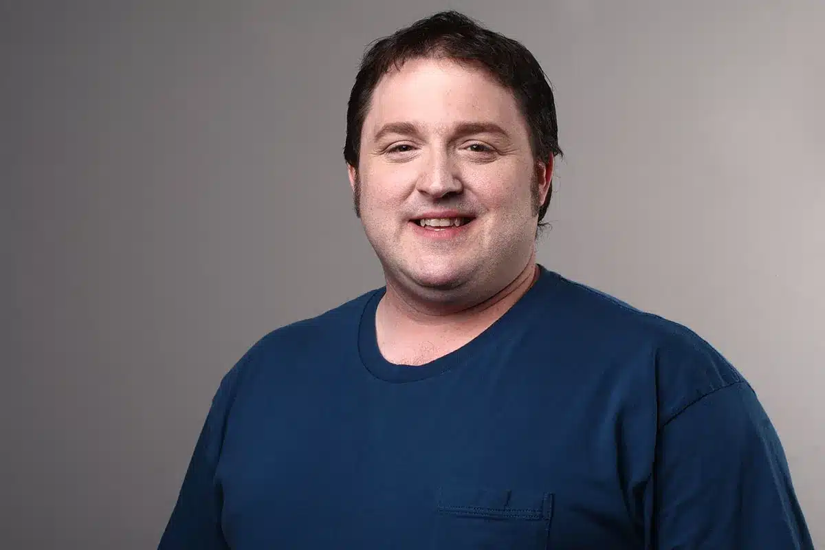 Man smiling for a portrait.