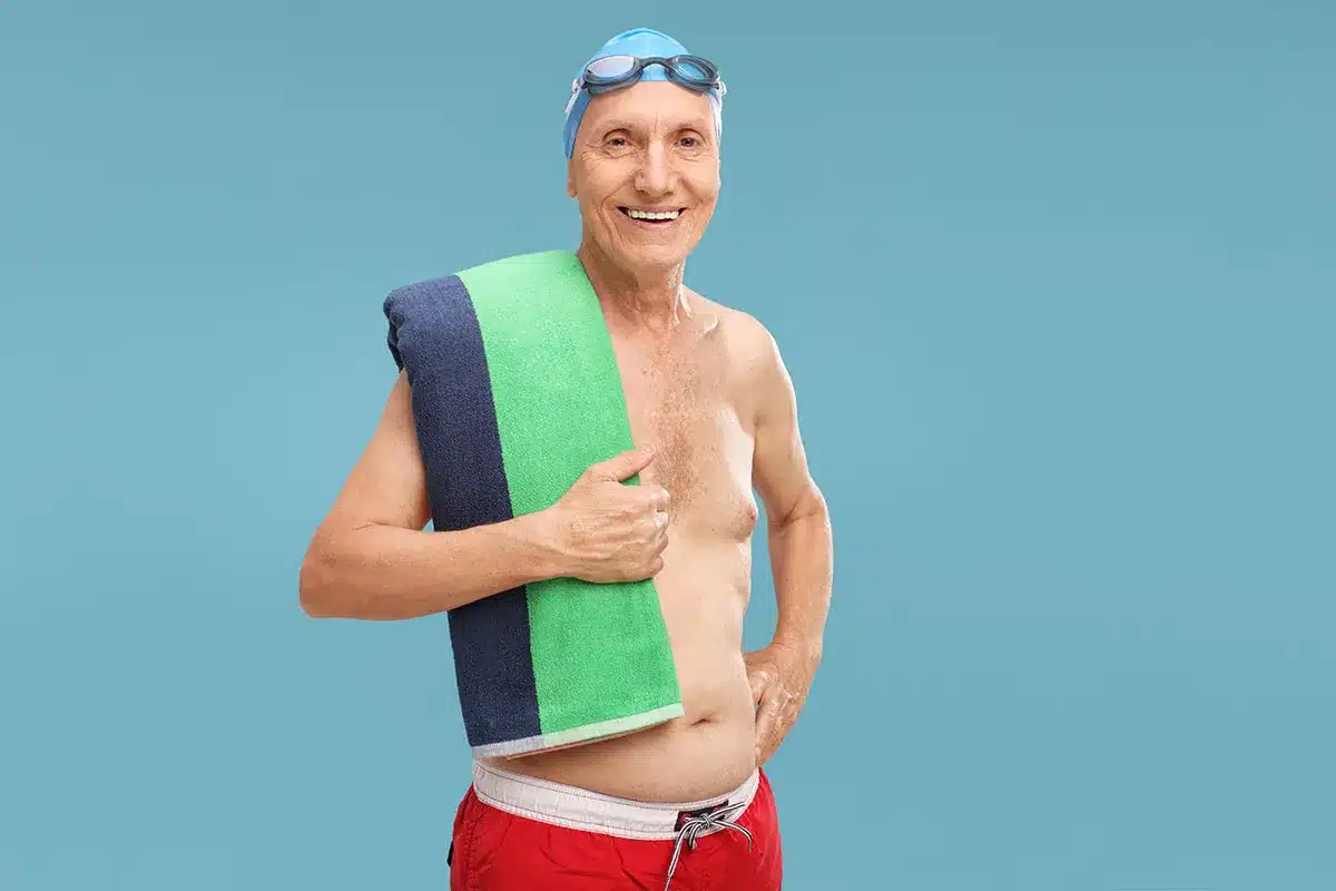 Happy senior man after swimming.