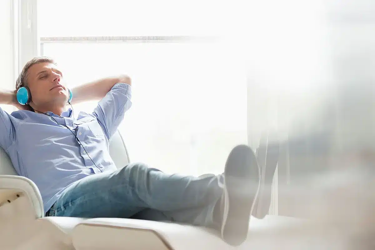 Man relaxing with headphones.