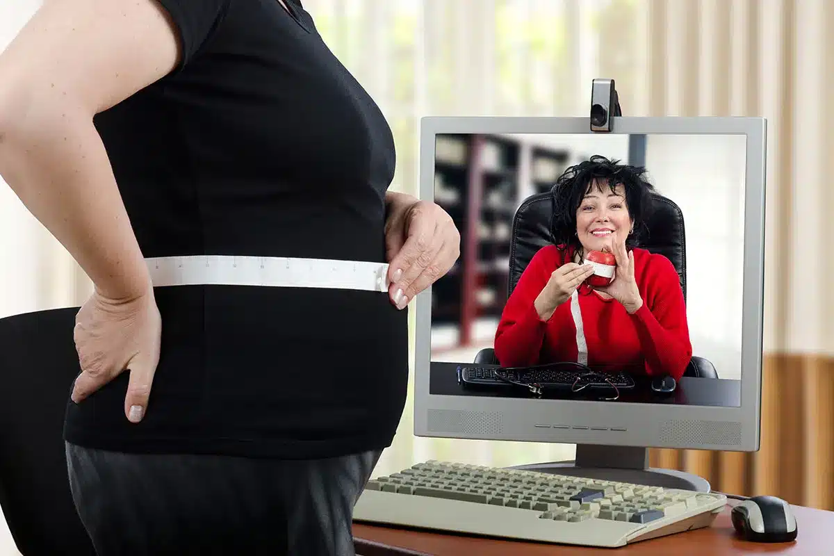 Pregnant woman with online doctor consultation.