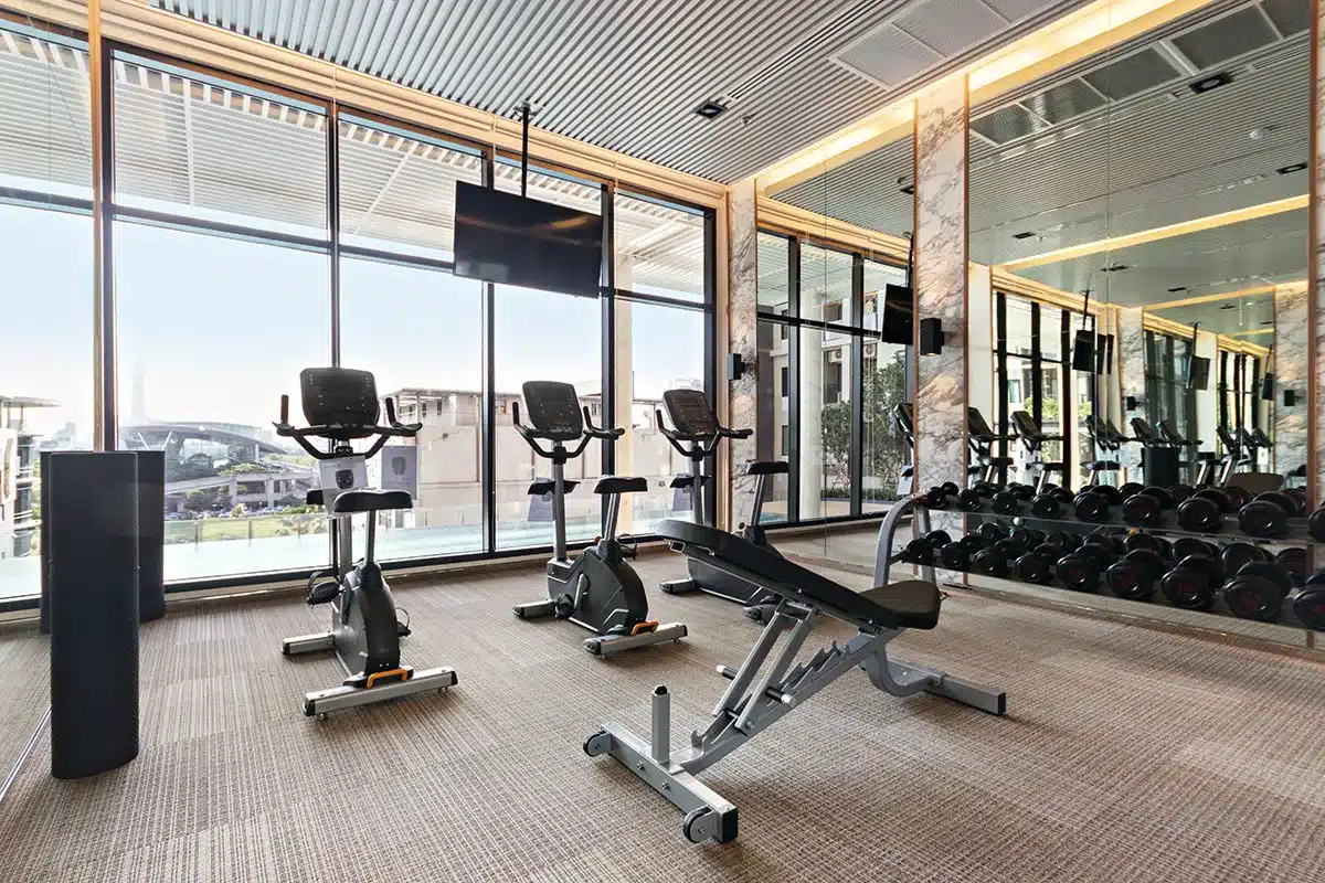 Modern gym with exercise equipment.