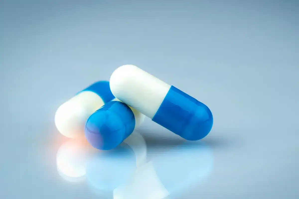 Close-up of blue and white capsules.
