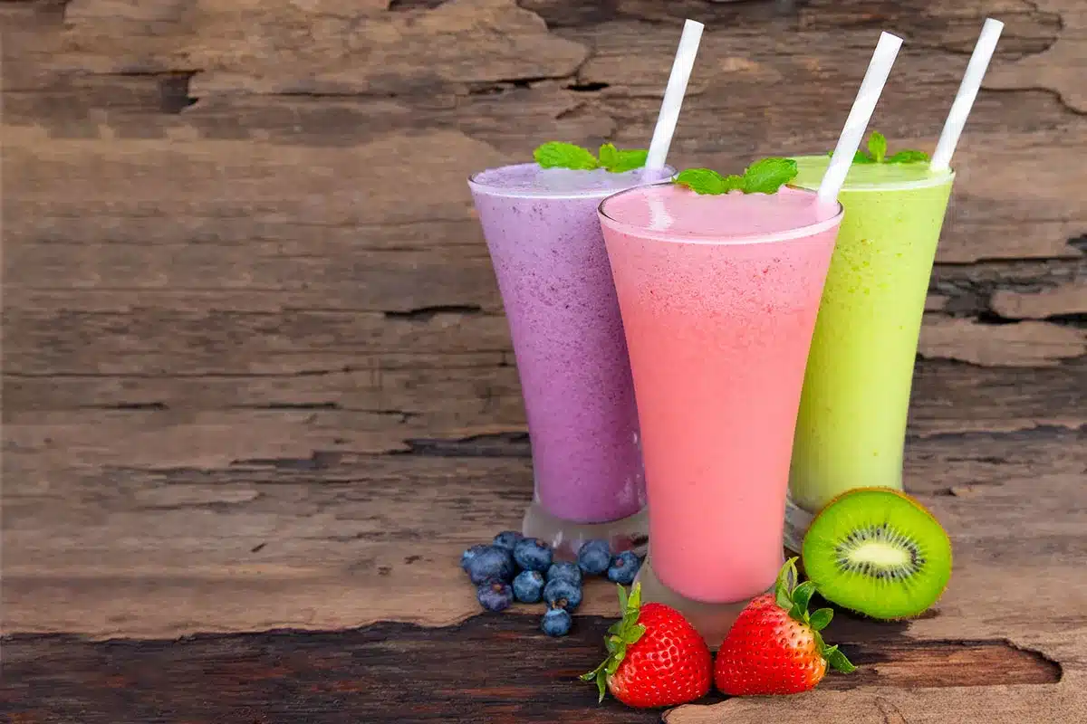Three colorful fruit smoothies.
