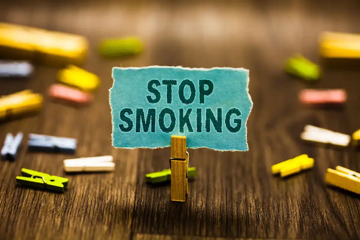 Stop smoking message on a sign.