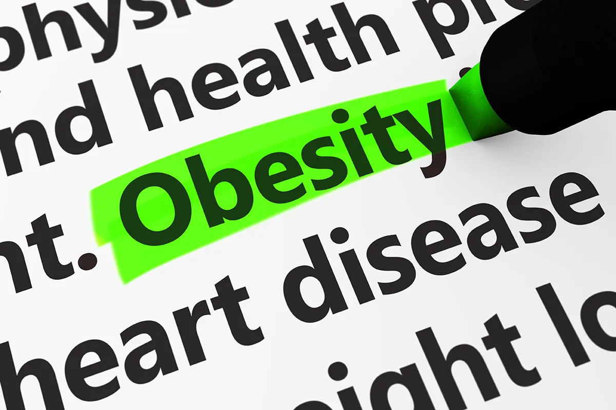 The word "Obesity" highlighted in green.