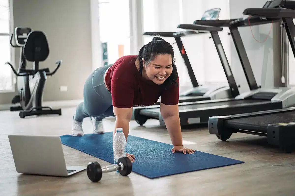 Plus-size woman doing a plank.