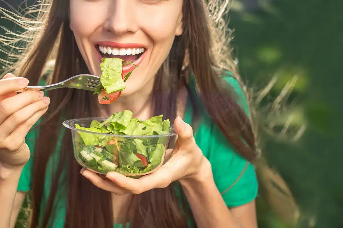 Woman eating a healthy salad.