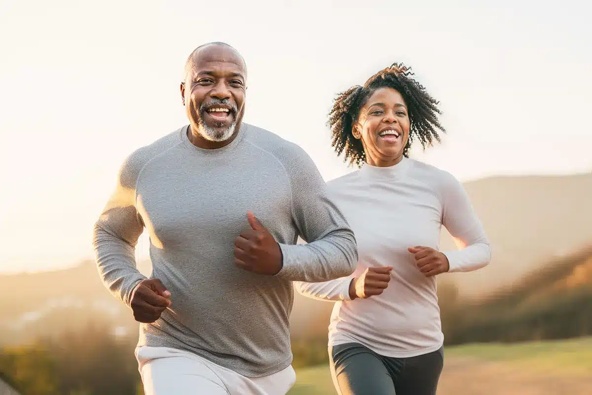 Happy couple jogging outdoors.