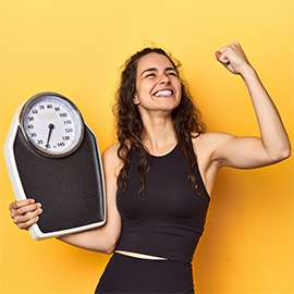 Young caucasian woman with scale, weight management concept