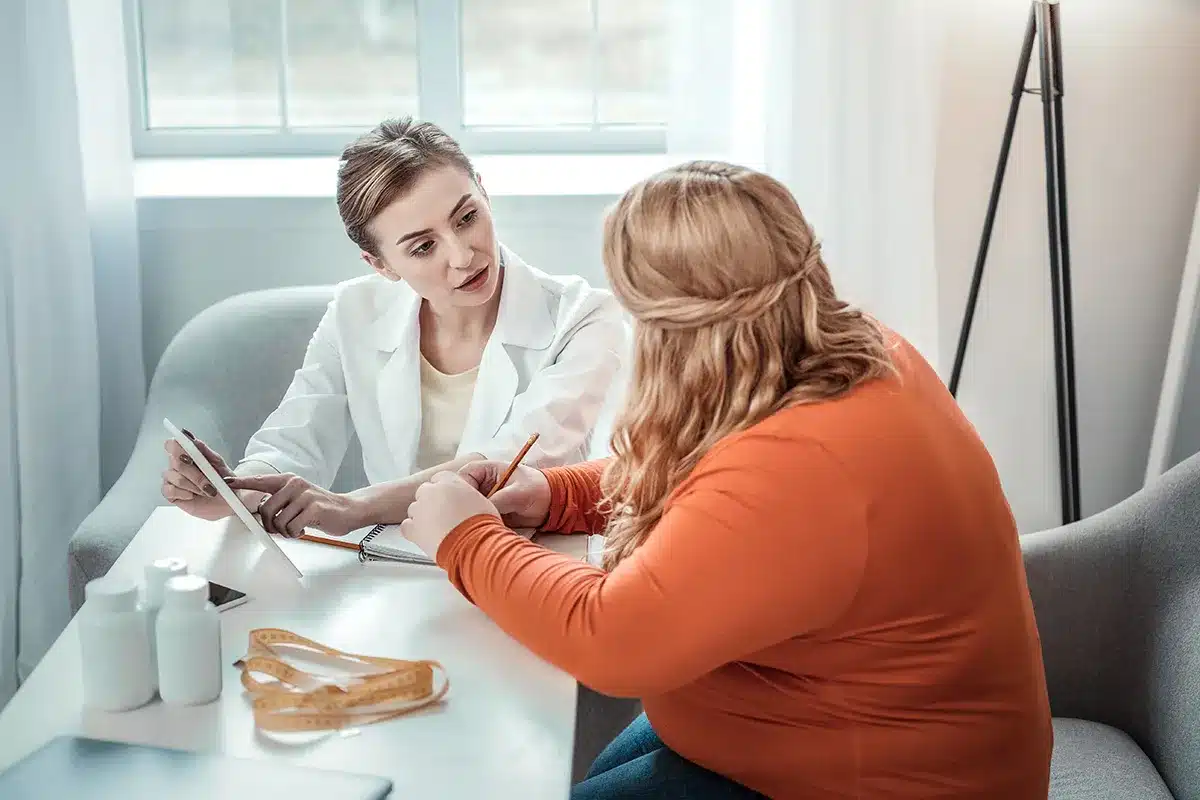 Doctor and patient discussing health plan.